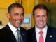 former president barack obama standing next to new york governor andrew cuomo