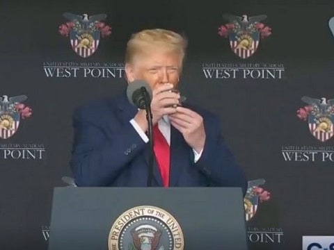 trump holding a glass of water with both hands at west point graduation 2020