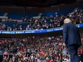 donald trump walking onto the stage at the 2020 tulsa rally