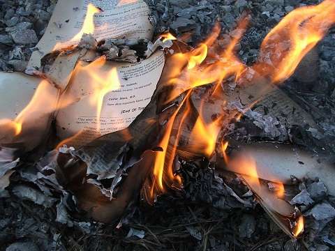 a book being burned as a form of censorship