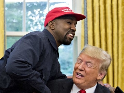 kanye west wearing a maga hat in the oval office while hugging donald trump