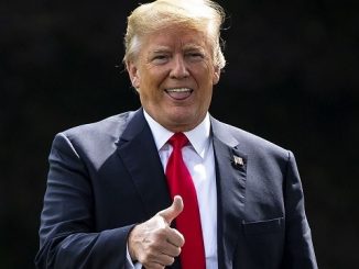 president donald trump sticking out his tongue and giving a thumbs up