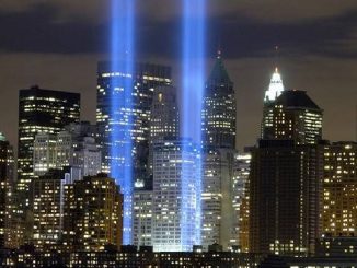 night shot of twin towers 9-11 memorial spotlights