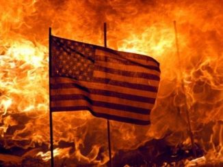 american flag flying in front of a burning fire