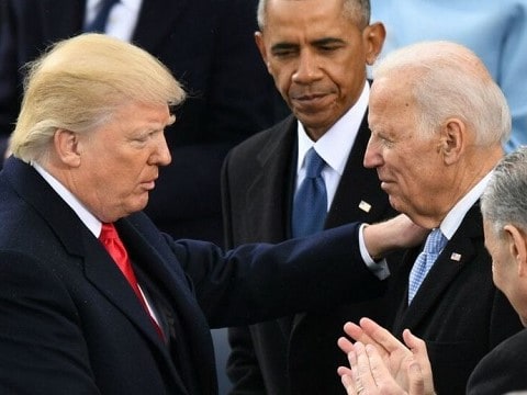 president trump with his hand on joe biden's shoulder