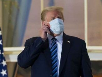 Trump removes mask