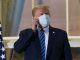 Trump removes mask