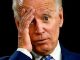 joe biden with hand on head