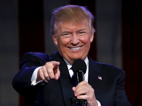 donald trump smiling and pointing at the camera